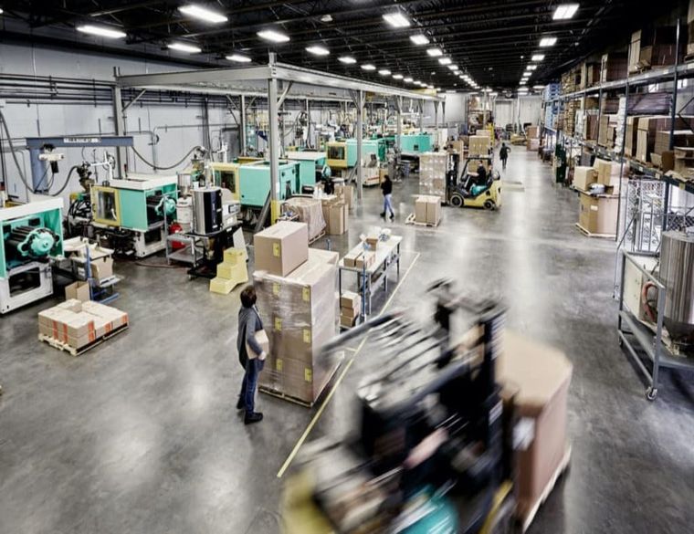 Rows of injection molding presses on the Plastic Alternatives production floor in Independence, Minnesota
